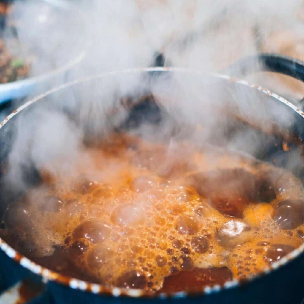 Steamy pot of quick Italian weeknight sauce, mid-disaster.