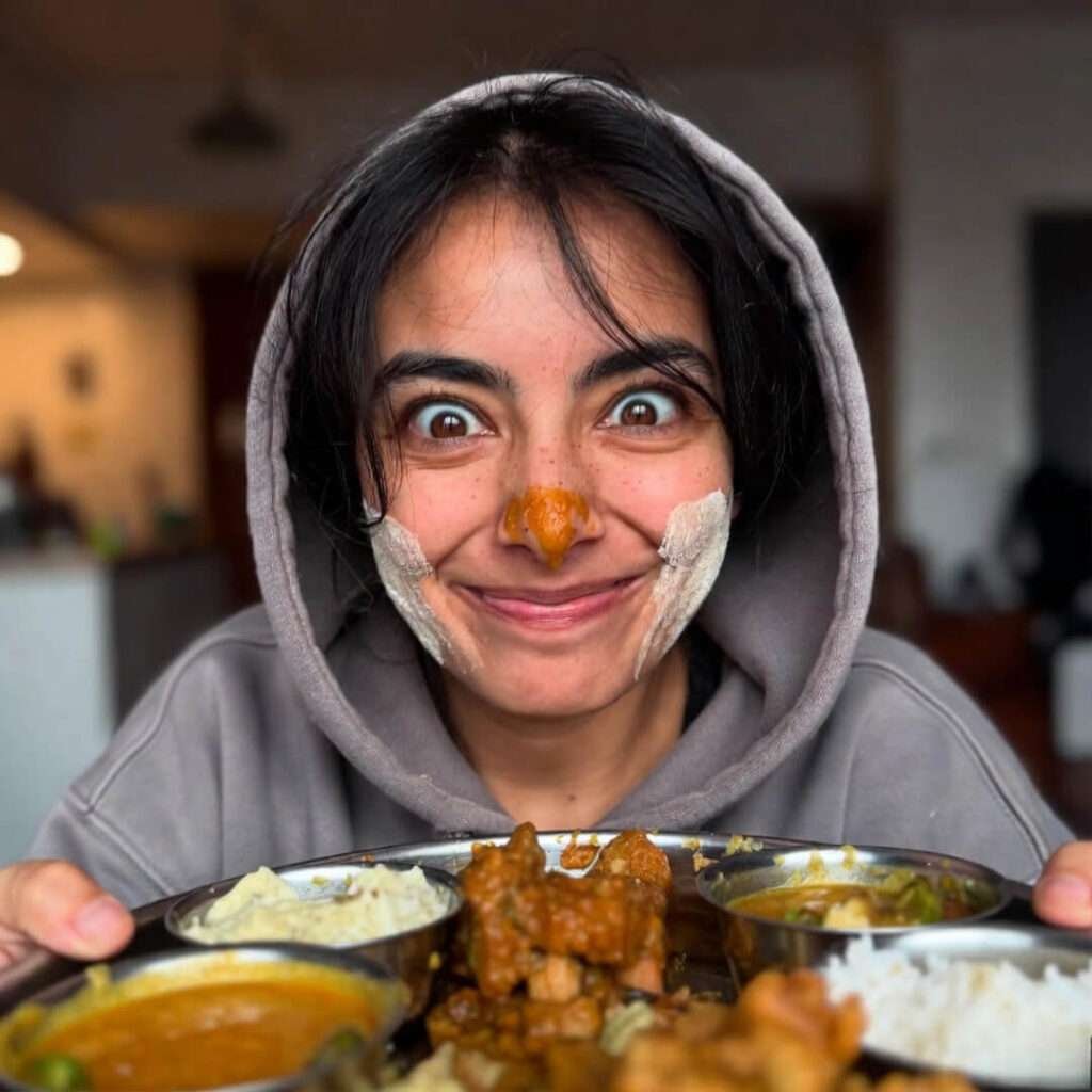 Messy aloo gobi plate, low-angle feast.