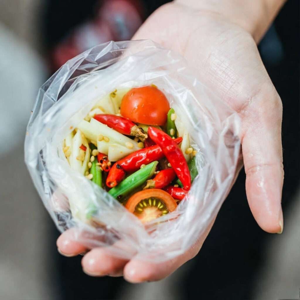 Sweaty hand clutching lethal chili som tam