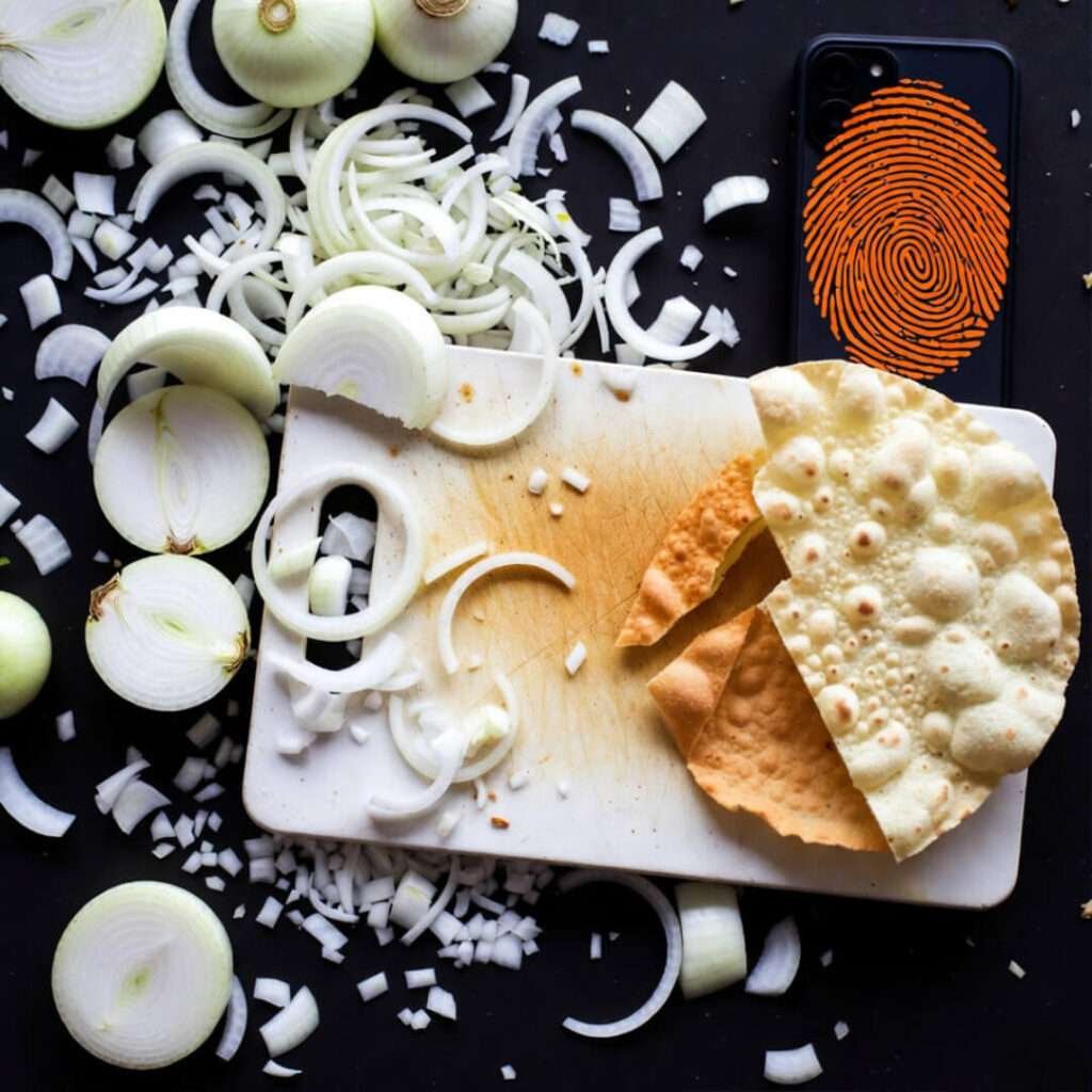 a single papdi broken in half like my life choices, bright orange fingerprints
